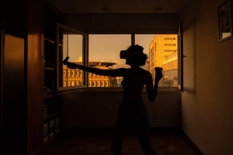 woman playing VR in her room